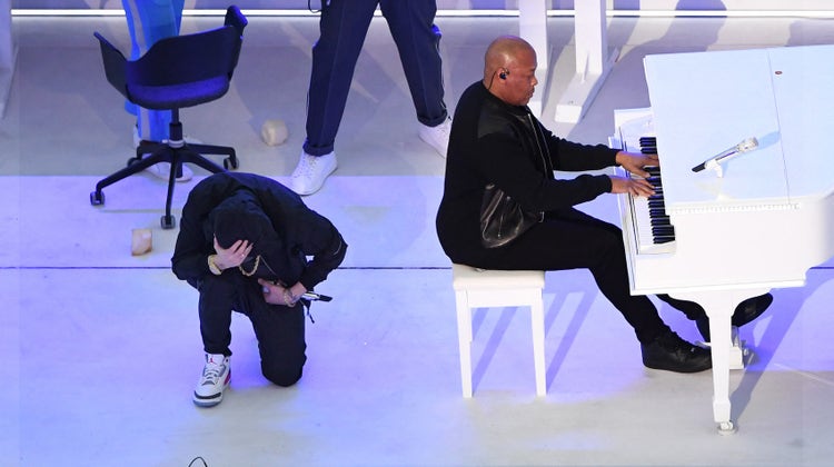 Eminem kneels during halftime show