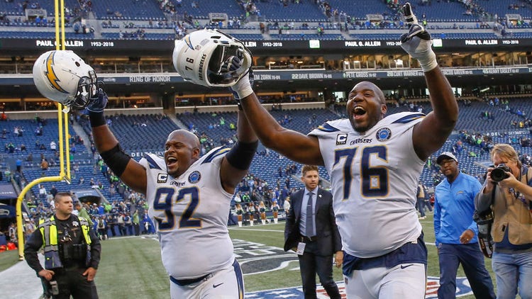 Brandon Mebane #92 and Russell Okung #76