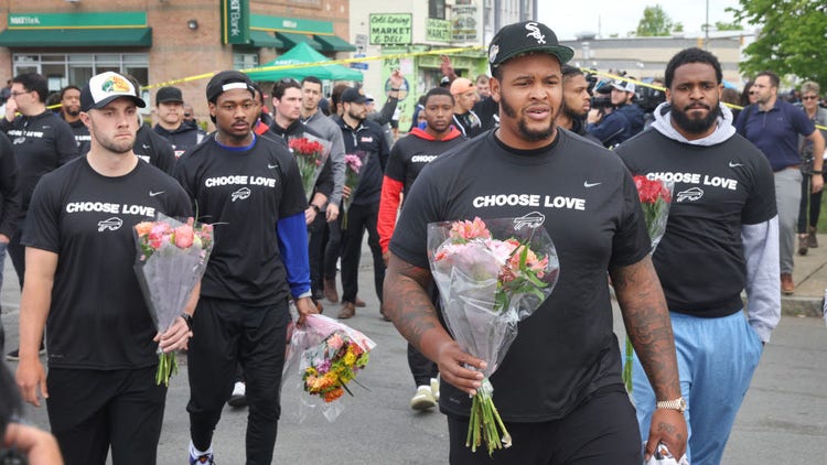 Buffalo Bills players visit a memorial