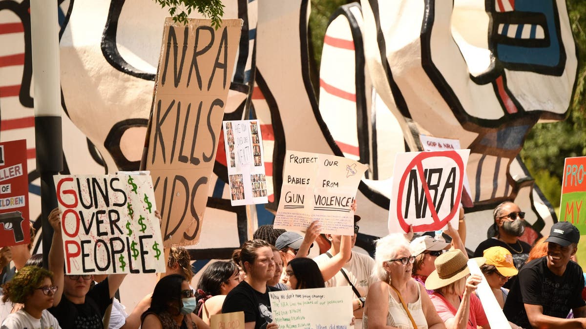 Thousands protest outside NRA convention days after Texas shooting