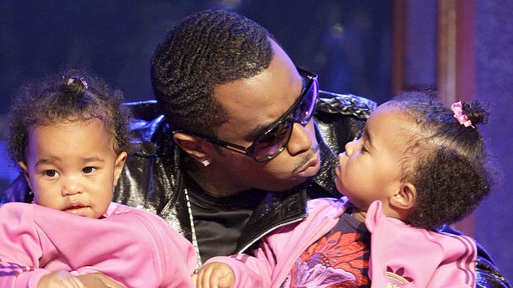 Sean Diddy Combs with twin daughters
