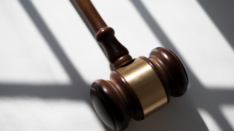 Gavel, prison bars