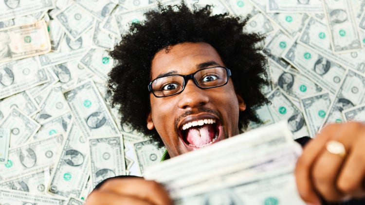 Black man holding money