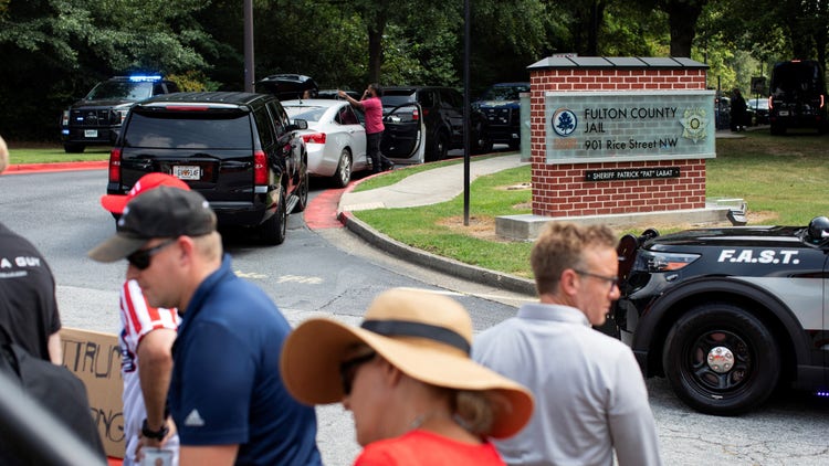 People gather outside the Fulton County Jail in Atlanta, Georgia, the United States, Aug. 24, 2023.