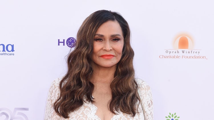A person with long hair Description automatically generated