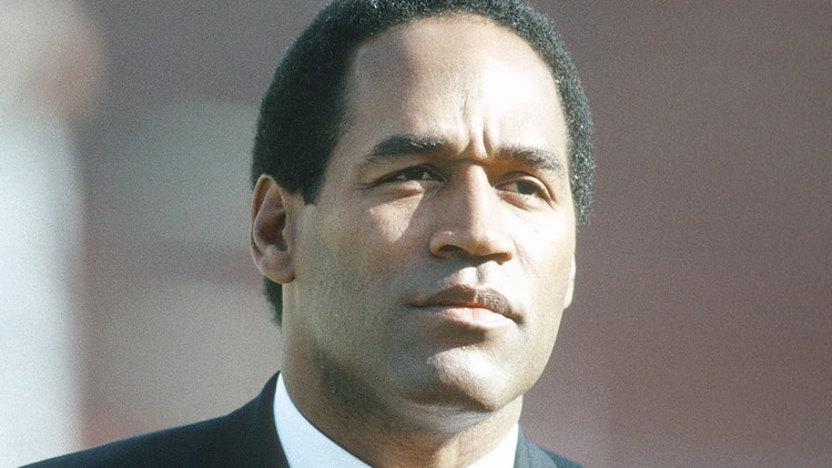 A person in a suit and tie Description automatically generated