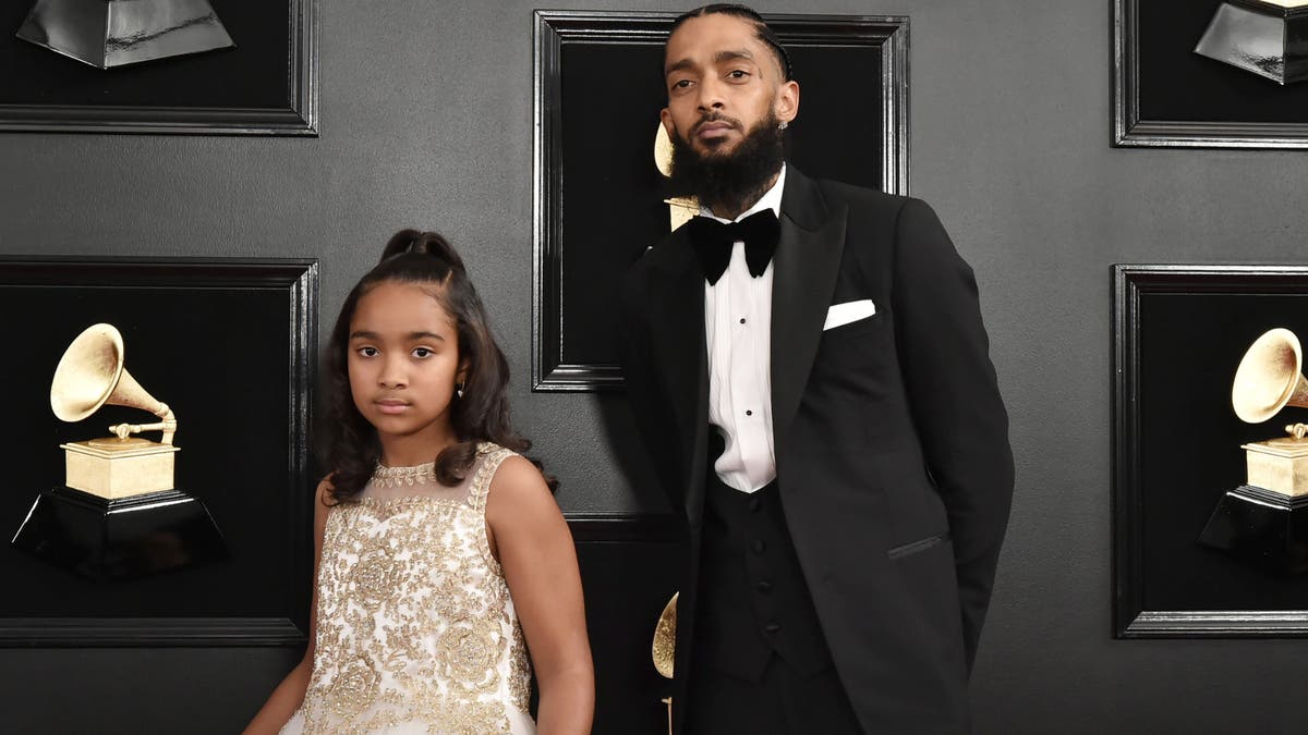 Congrats, grad: Nipsey Hussle’s daughter celebrates high school graduation with family by her side
