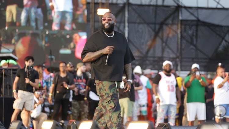 A person wearing a black shirt and camouflage pants Description automatically generated